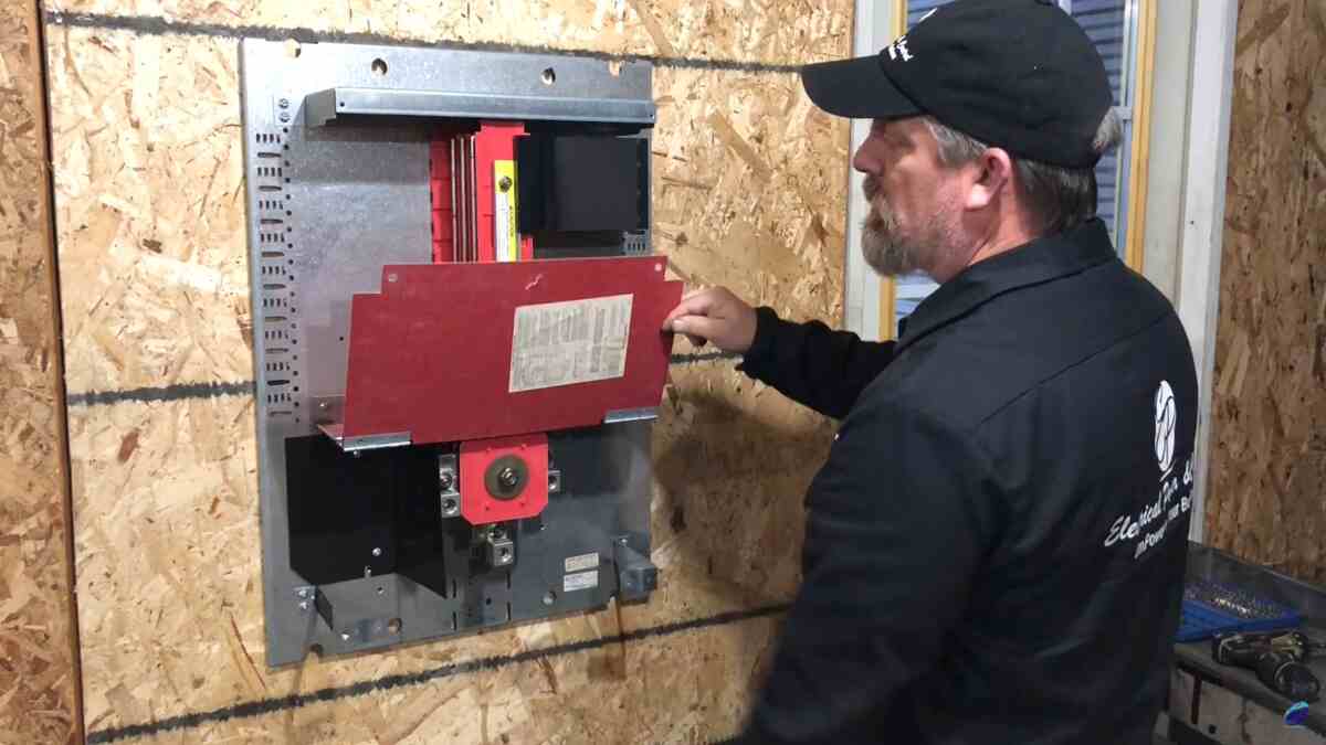 I-Line-breaker-installation-step-aligning-hooks-with-teardrop-slots