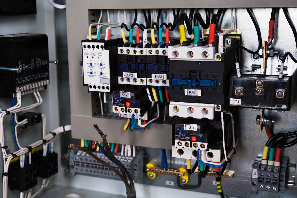 Facility manager reviewing circuit breaker compatibility requirements before selecting replacement 