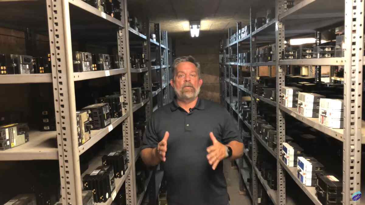 Electrical professional evaluating circuit breaker compatibility prevent equipment